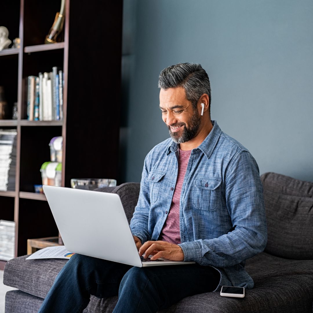 Man on laptop - UK Electronic Travel Authorisation